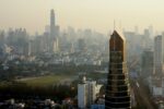 Dust, smoke haze and smogin Bangkok from a roof of Phaholyothin Place tower in Samsen Nai.