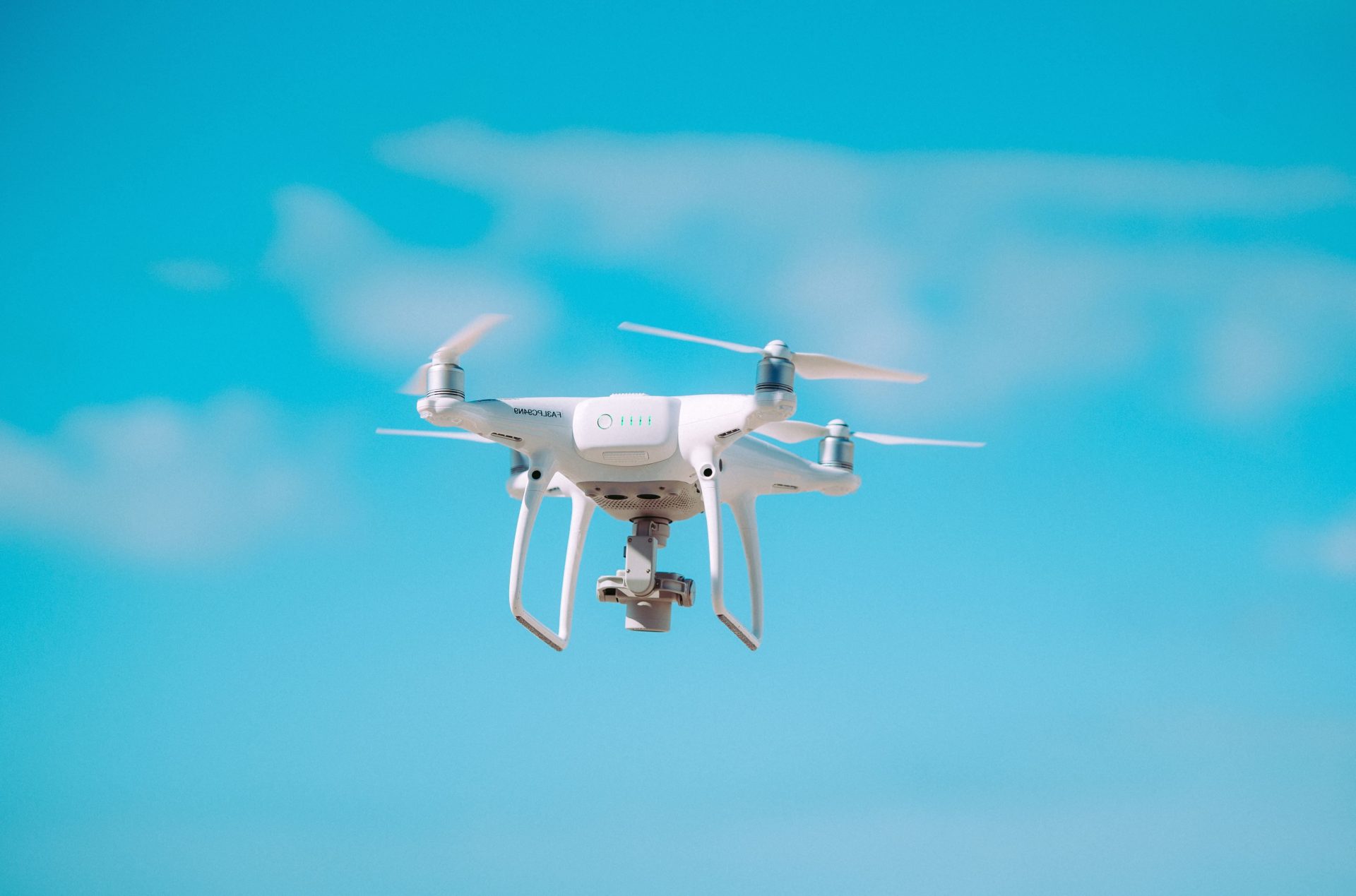 A white drone with camera.