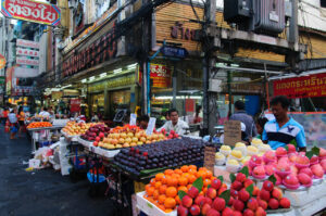 A gold shop near the street food vendors' stalls in a market