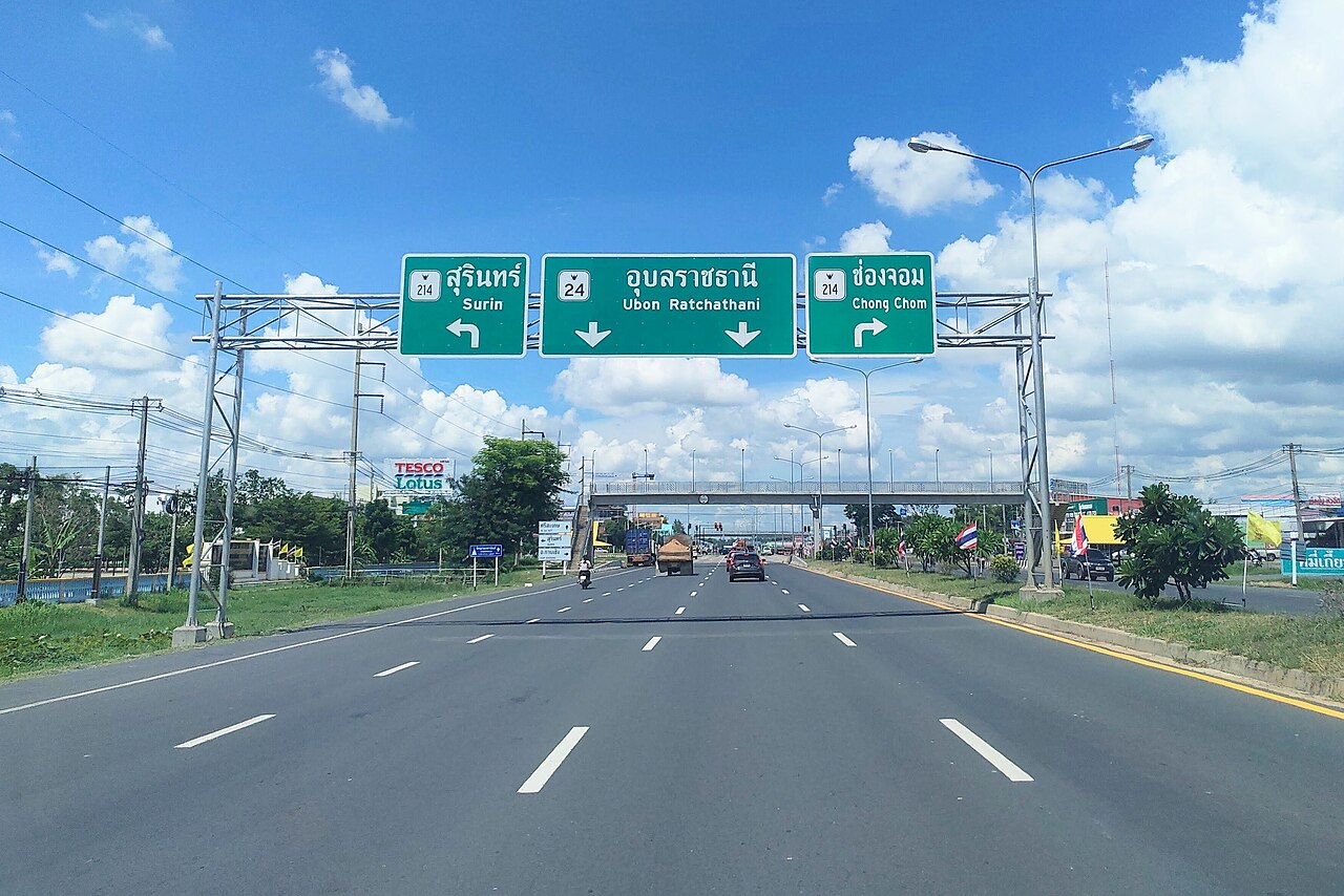 Thai National Highway No. 24, at the Prasat intersection, Prasat, Surin. Signs for Ubon Ratchathani and Chong Chom.