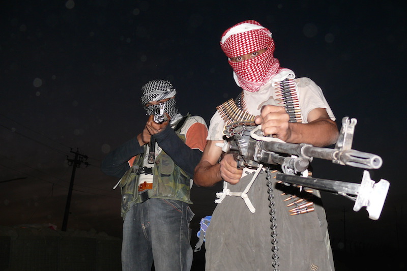 Iraqi insurgents with guns