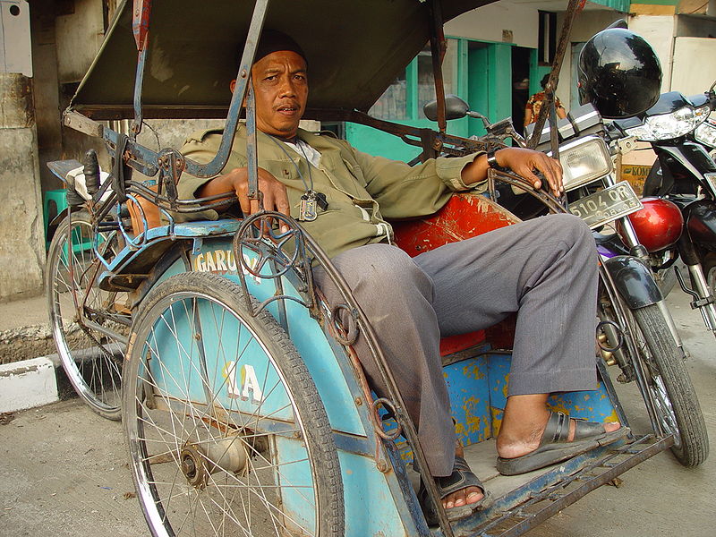 Becak and driver in Ciputat, Indonesia
