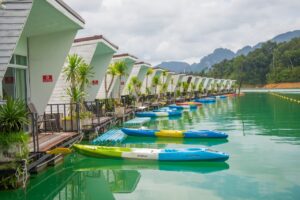 Kayaks moored in front of floating houses on the Cheow Lan Lake, Khao Sok National Park.