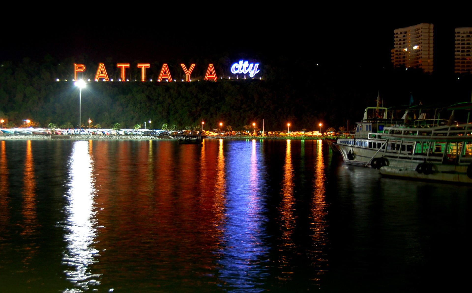 Night view of the Pattaya city sign from Pattaya beach.