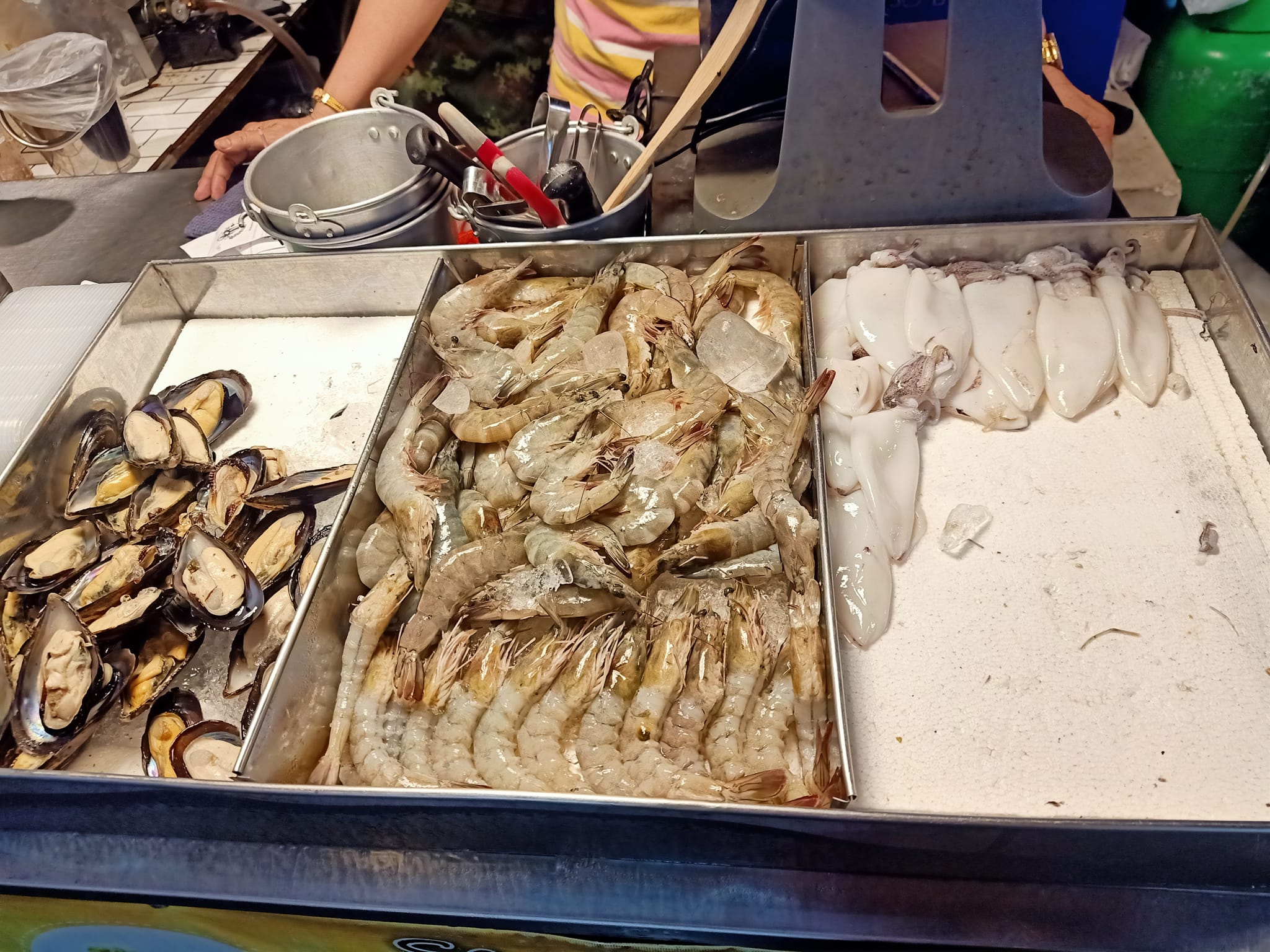 Seafood vendor at a night market in Samut Prakan.