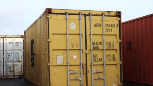 Containers stacked in a row on the street