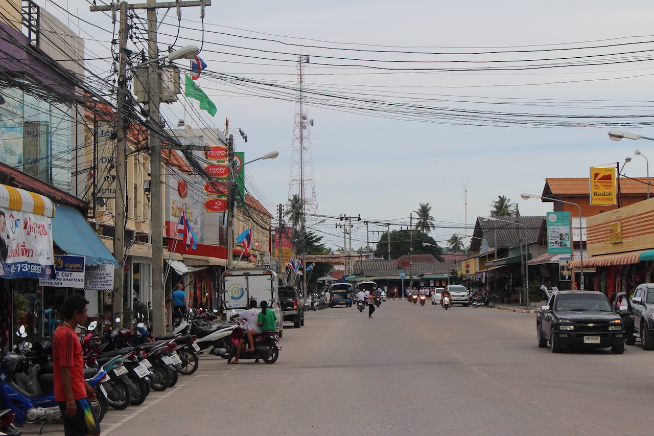 Motorcycles parked on a street in Koh Phangan.