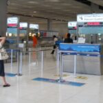 Immigration passport control counter at Suvarnabhumi airport in Bangkok.