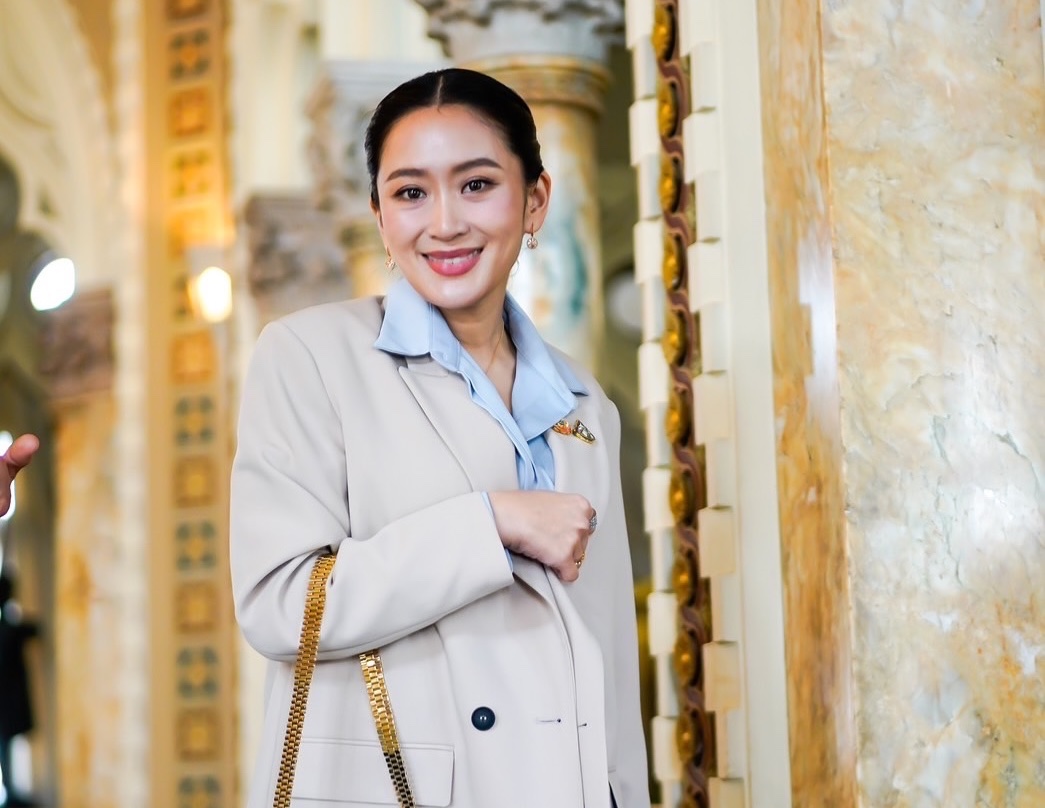 Thai Prime Minister Paetongtarn Shinawatra poses in front of a column.