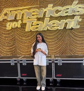 Rattikarn Amloy, known by the stage name Nene Royal, posing at the America's Got Talent stage.