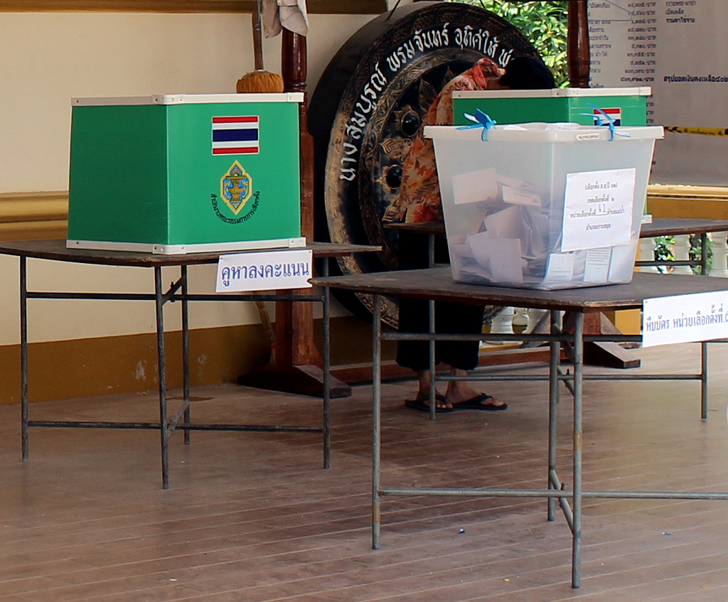 A voter casts ballot in a voting booth at the Thai general election.