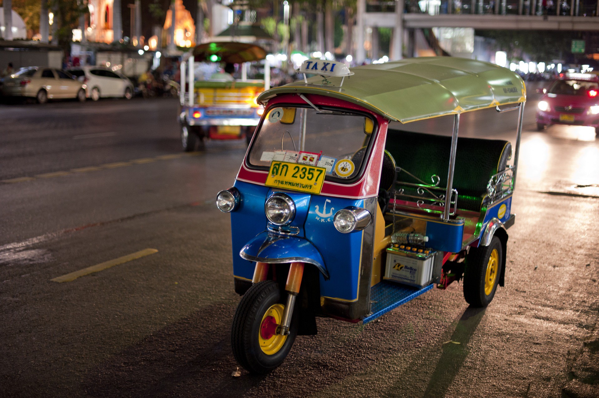 Riding a tuk-tuk at night in Bangkok.