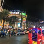 Taxis and motorcycles in Patong, Kathu District, Phuket