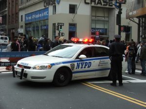 Policemen and NYPD New York police car