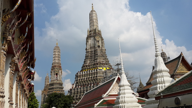 View of Wat Arun on the Chao Phraya river bank in Bangkok