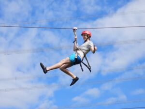 Tourist on a zip line in Thailand.