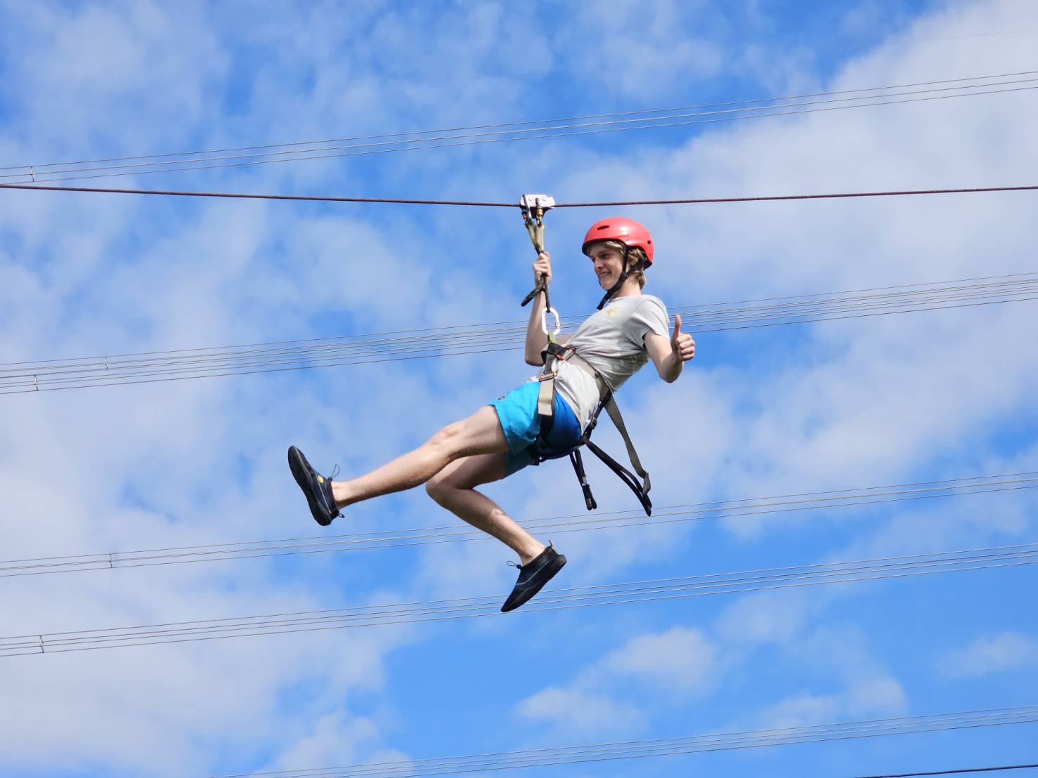 Tourist on a zip line in Thailand.