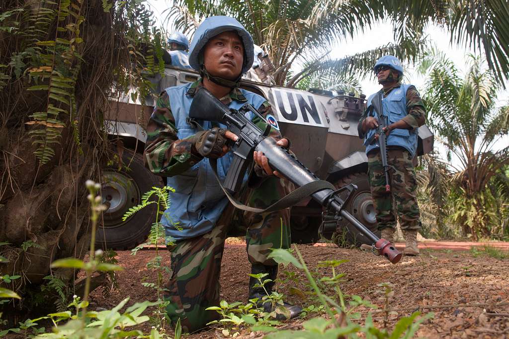 A soldier from the Royal Cambodian Army ensures security while escorting a convoy.