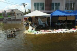 Flood water covers the roads in the northern Sai Mai