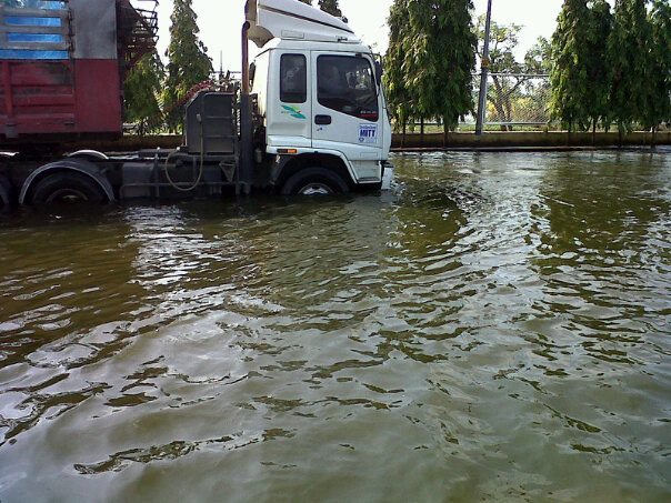 Truck Drives Through Flooded Street in Thailand.