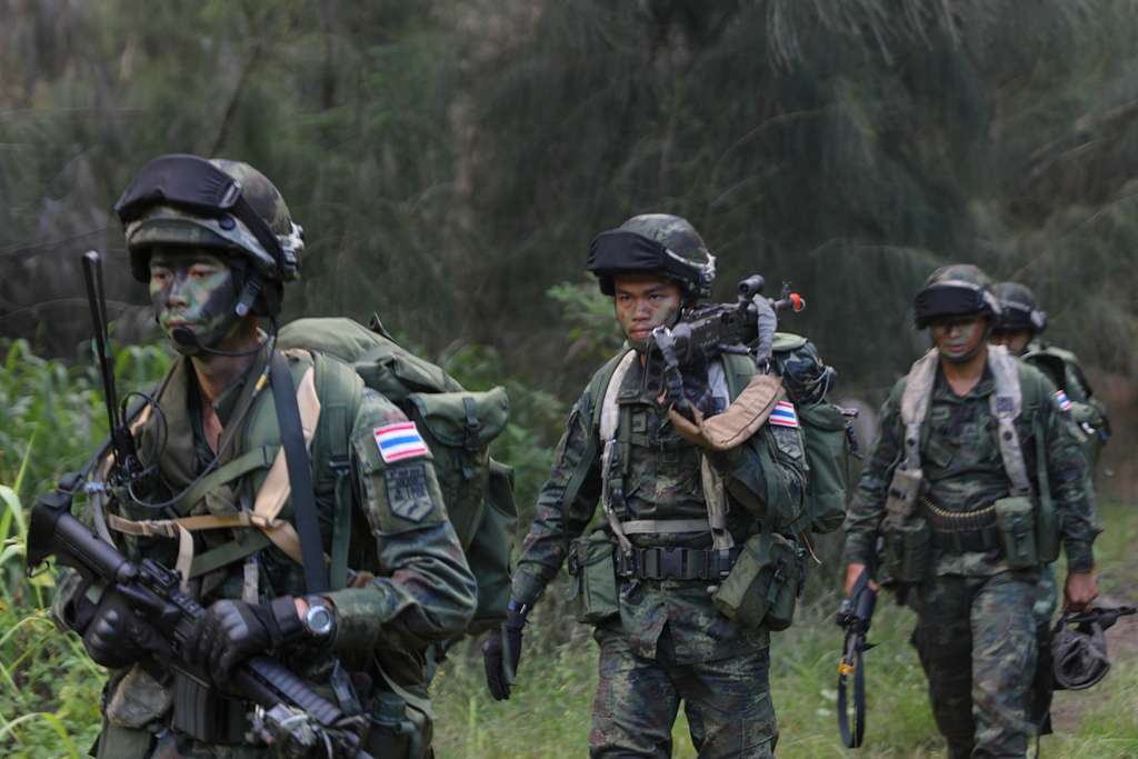 Soldiers from the Royal Thai Army patrol through the jungle.