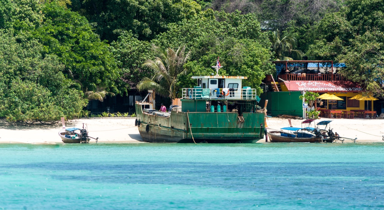 A tugboat near the beach.